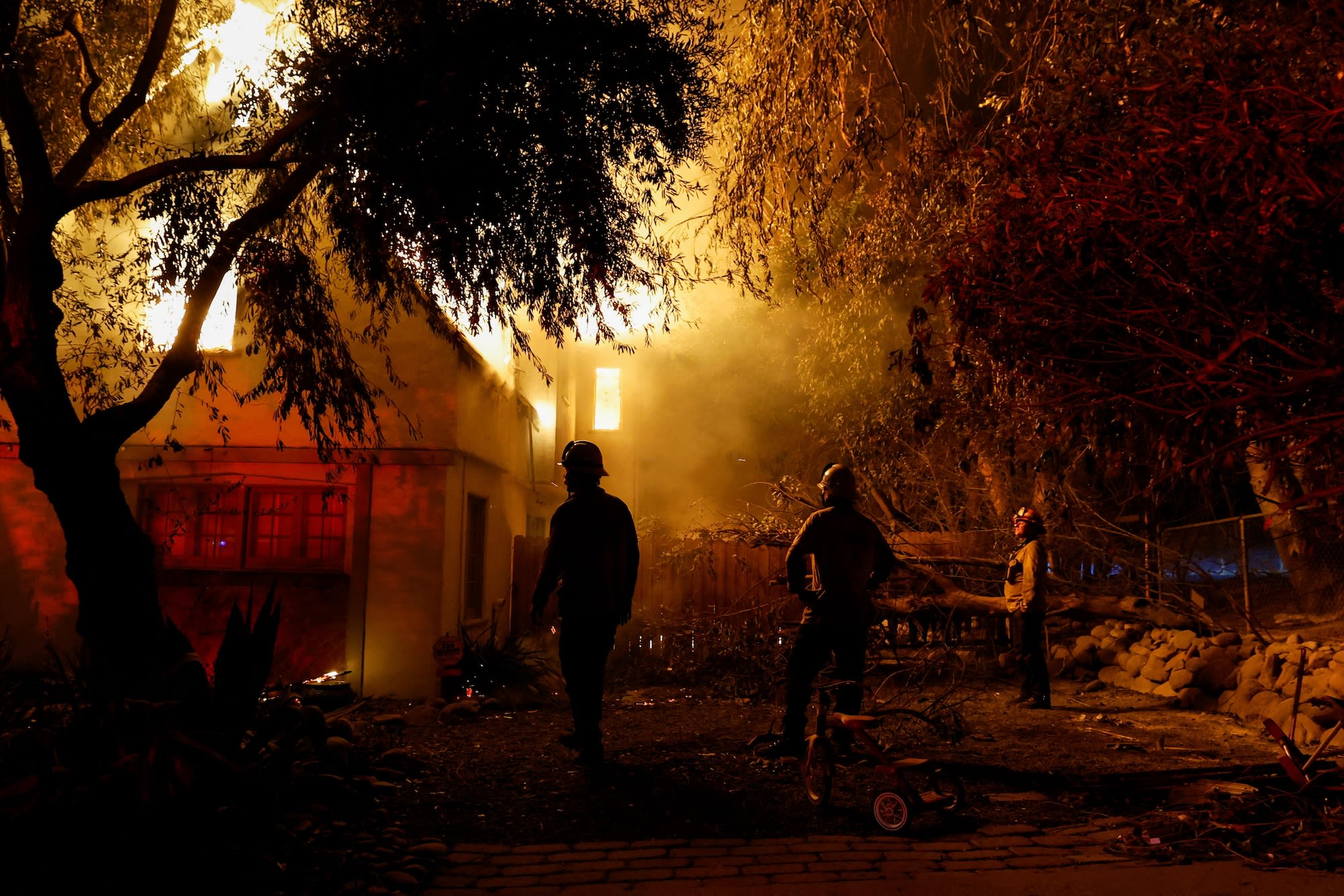 <i>Carolyn Kaster/AP via CNN Newsource</i><br/>Homes and trees destroyed by the Palisades Fire are seen along the coastline on January 15