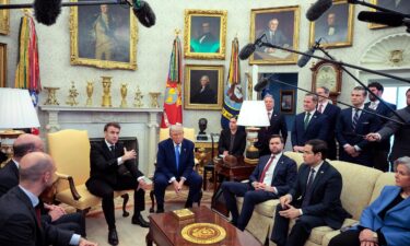 President Donald Trump meets with French President Emmanuel Macron in the Oval Office at the White House on February 24.