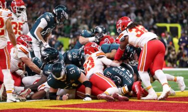 Philadelphia Eagles quarterback Jalen Hurts scores a touchdown on the "Tush Push" play during the team's Super Bowl win against the Kansas City Chiefs.