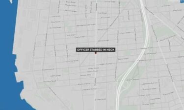 An on-duty Camden police officer was stabbed in the neck on Sunday night in a "senseless act