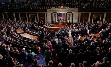 Republicans stand and Democrats sit as President Donald Trump addresses a joint session of Congress in the House chamber at the US Capitol in Washington