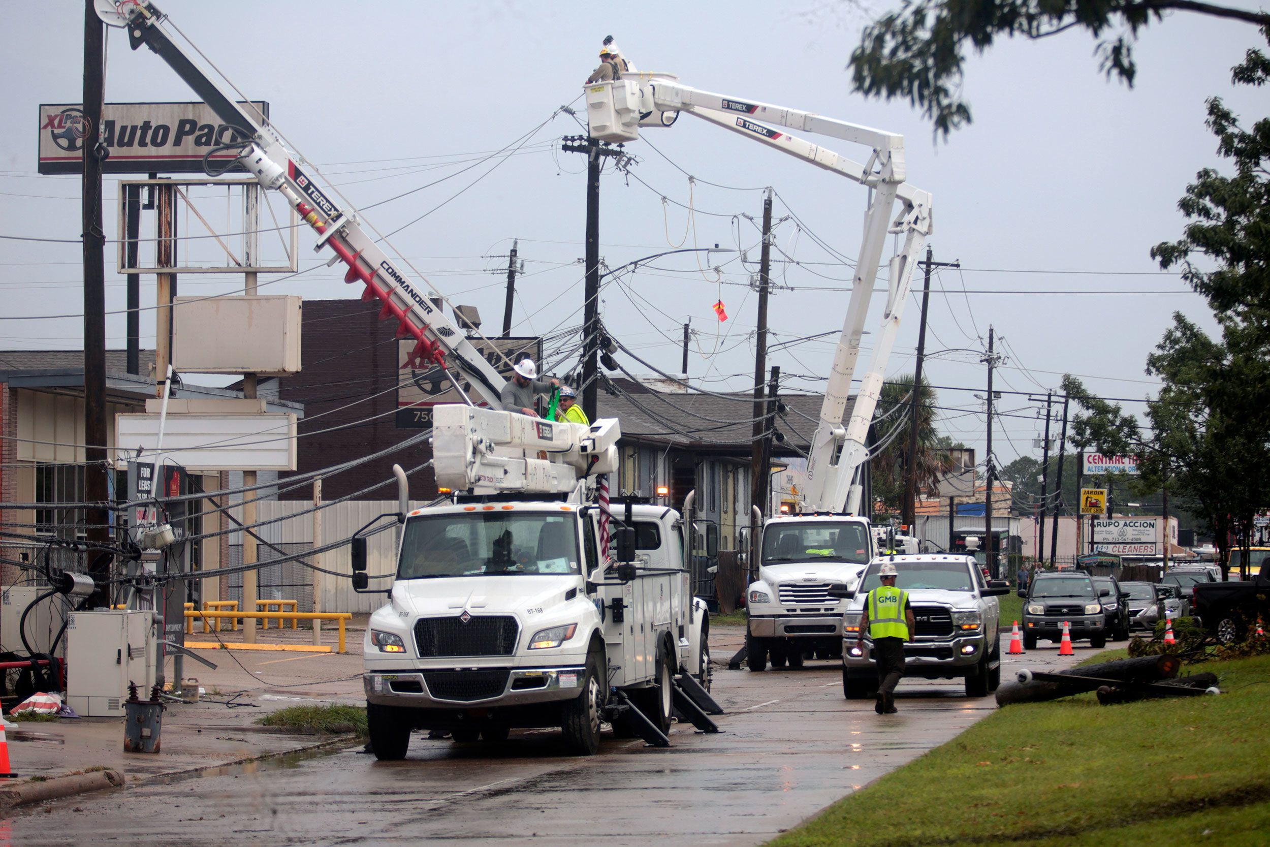 <i>Lekan Oyekanmi/AP via CNN Newsource</i><br/>Utility crews work to restore electricity in Houston in the aftermath of Hurricane Beryl on July 11
