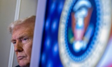 President Donald Trump speaks to journalists aboard Air Force One as he travels from West Palm Beach back to Washington on March 9.