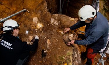 Archaeologists excavate near the cave at the Sima del Elefante site