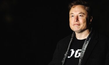 Elon Musk walks to the White House after landing in Marine One on the South Lawn with US President Donald Trump in Washington