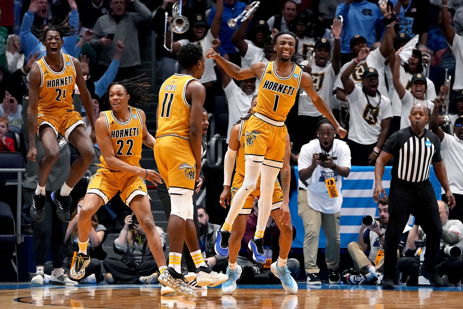 <i>Dylan Buell/Getty Images North America/Getty Images via CNN Newsource</i><br/>Alabama State guard Amarr Knox celebrates with teammates after making the would-be game winning laup against St. Francis (PA) in the First Four game.
