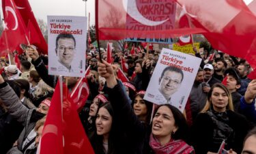 Demonstrators chant slogans as they hold posters in support of arrested Istanbul Mayor Ekrem Imamoglu in Istanbul