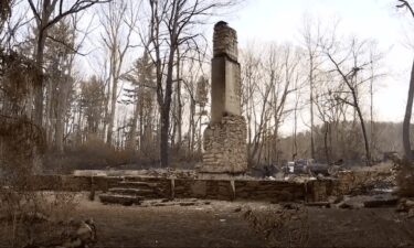 The burned remains of Matthew Rogers' "Cabin of Hope" home in Flat Rock after wildfires grew and spread into the region.