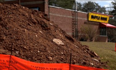 A sinkhole caused by weather events preceding Hurricane Helene formed outside of the Waffle House in Mars Hill