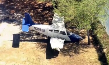 A small plane with two people on board made an emergency landing on a field next to an elementary school in Miramar