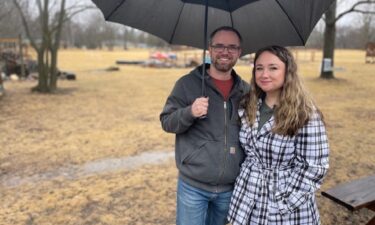 Jennifer Sleider and her husband stand on their 2-acre property in Brookfield. They hope a state law passes so they can get backyard chickens.