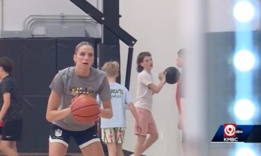 With a basketball in her hand