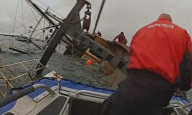 Body camera video shows the moment Boston police officers rescued three fishermen from a sinking boat in Boston Harbor on Friday morning.