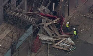 Two small cranes collapsed onto scaffolding outside a Midtown Manhattan building Friday afternoon