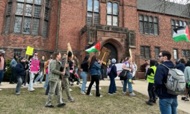 Dozens of people marched around the UW-Milwaukee campus Monday