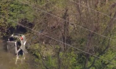 Divers retrieved the body of a man from a car that crashed into a New Albany creek.