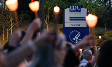 Dozens of people participated in a candlelight vigil in front of the US Centers for Disease Control last week after thousands of job cuts were announced at US health agencies.