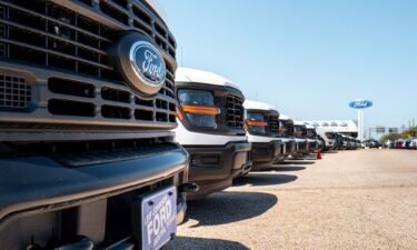 Ford-150 pickup trucks are displayed for sale at a dealership in Austin