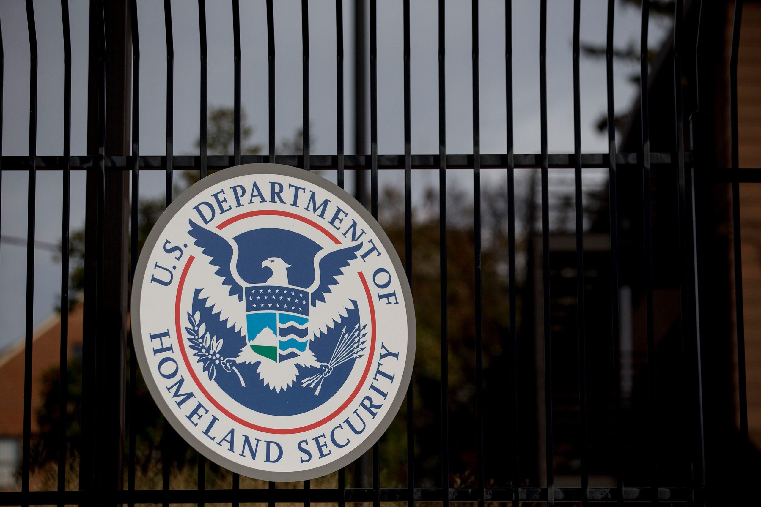 <i>Andrew Harrer/Bloomberg/Getty Images via CNN Newsource</i><br/>The US Department of Homeland Security (DHS) seal hangs on a fence at the agency's headquarters in Washington