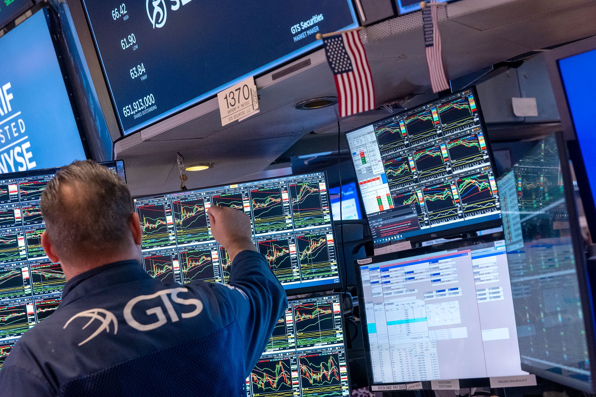 <i>Spencer Platt/Getty Images via CNN Newsource</i><br/>A trader works on the floor of the New York Stock Exchange. After markets plunged over the course of the past three trading sessions