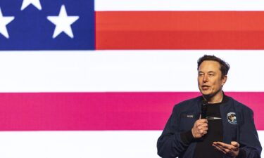 Elon Musk speaks during a town hall on March 30
