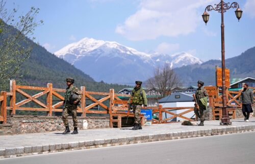 Jammu and Kashmir National Conference members attend a protest after tourists were killed