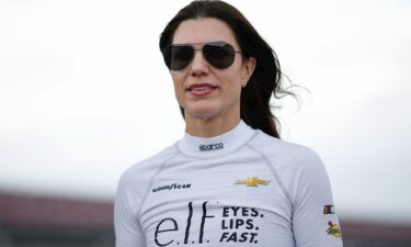 Katherine Legge walks the grid during qualifying for the NASCAR Xfinity Series Ag-Pro 300 at Talladega Superspeedway in Talladega