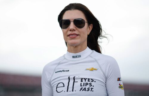 Katherine Legge walks the grid during qualifying for the NASCAR Xfinity Series Ag-Pro 300 at Talladega Superspeedway in Talladega