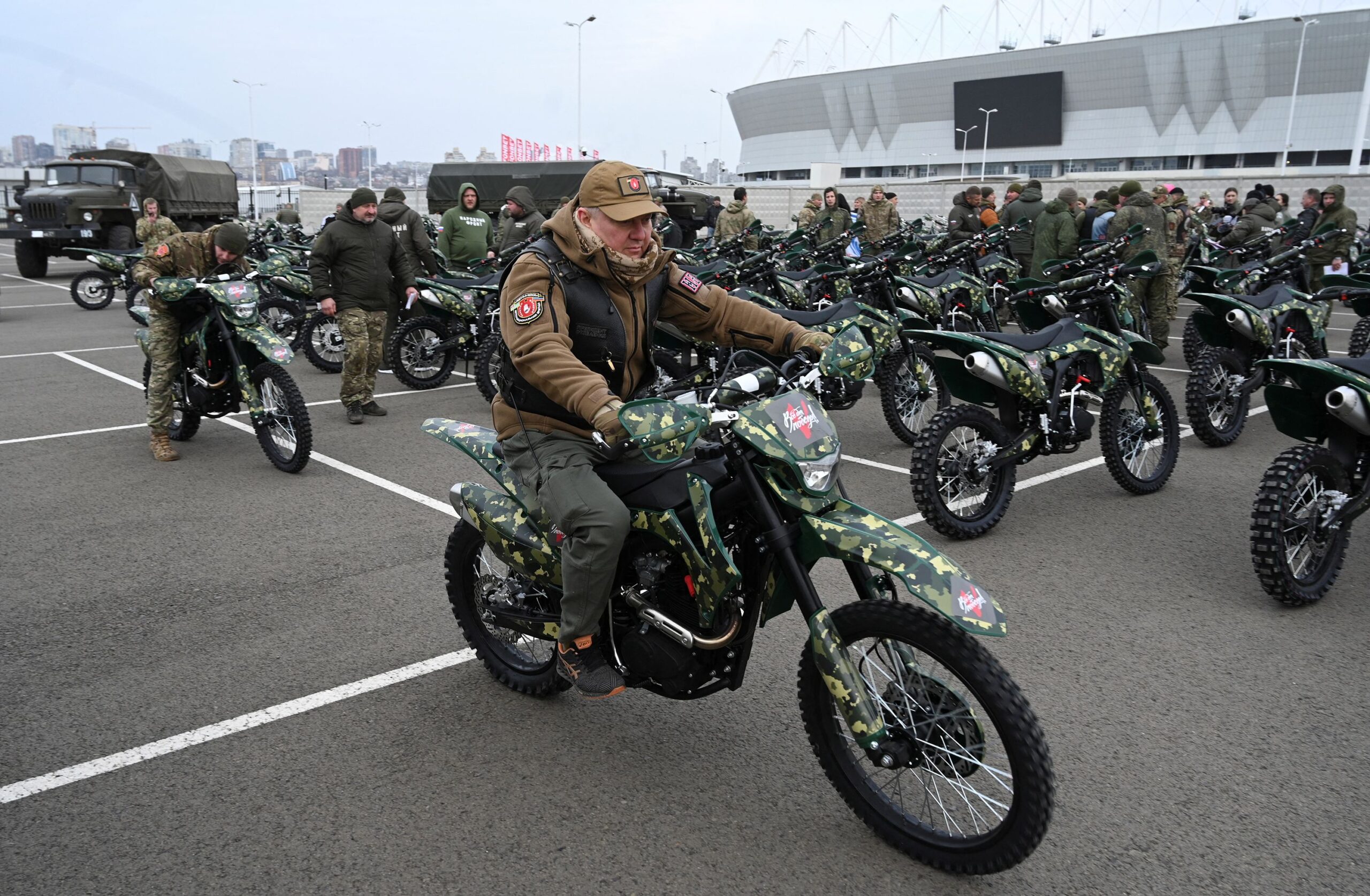<i>Sergey Pivovarov/Reuters via CNN Newsource</i><br/>Participants attend a ceremony to hand over new motocross bikes to the Russian military near a football stadium in Rostov-on-Don