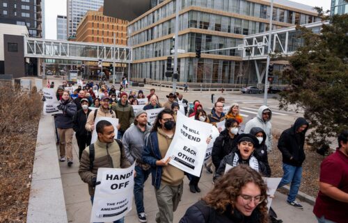 Union members march through downtown Minneapolis on March 29 after University of Minnesota international graduate student Doğukan Günaydin was detained by by ICE agents.