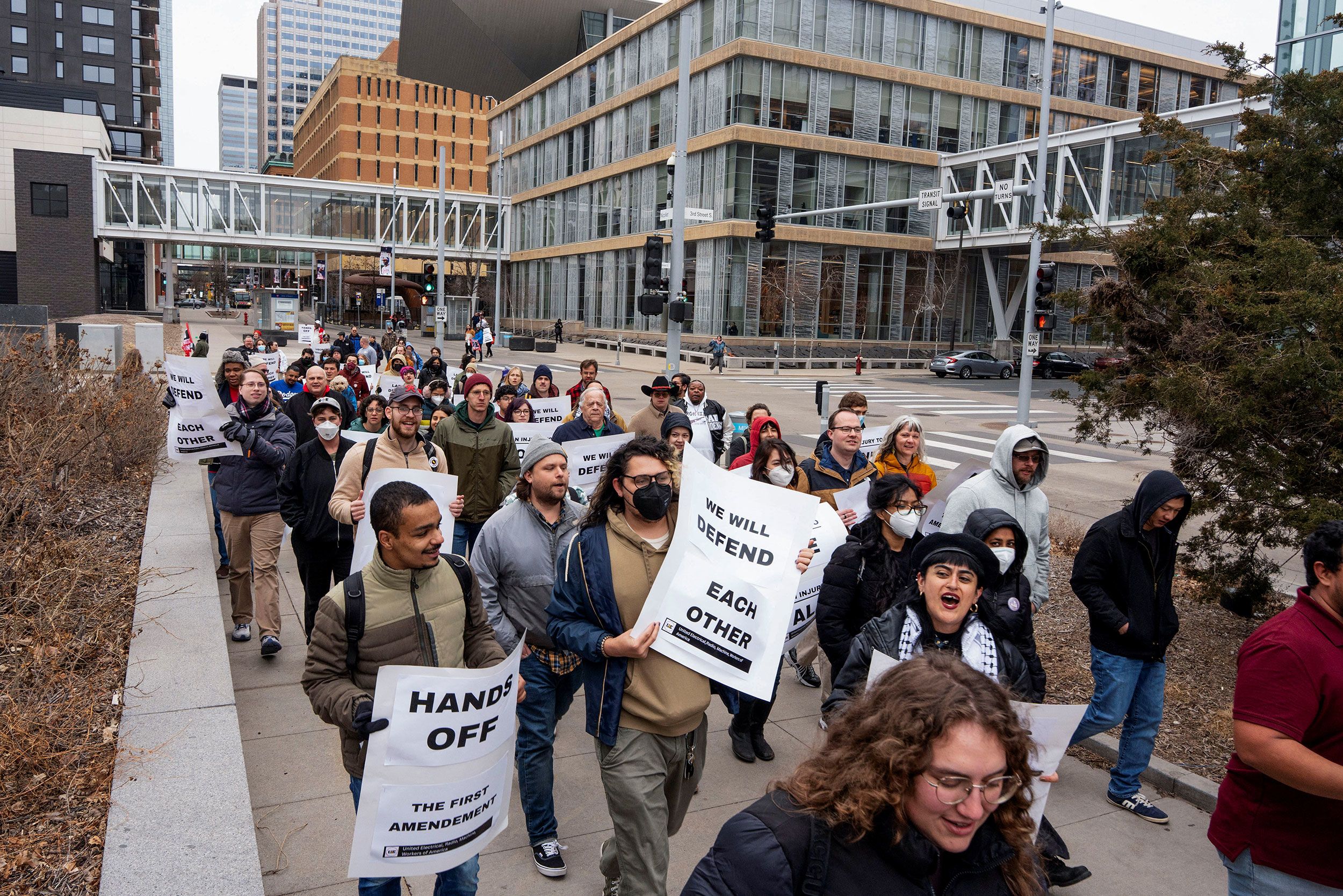 <i>Tim Evans/Reuters via CNN Newsource</i><br/>Union members march through downtown Minneapolis on March 29 after University of Minnesota international graduate student Doğukan Günaydin was detained by by ICE agents.
