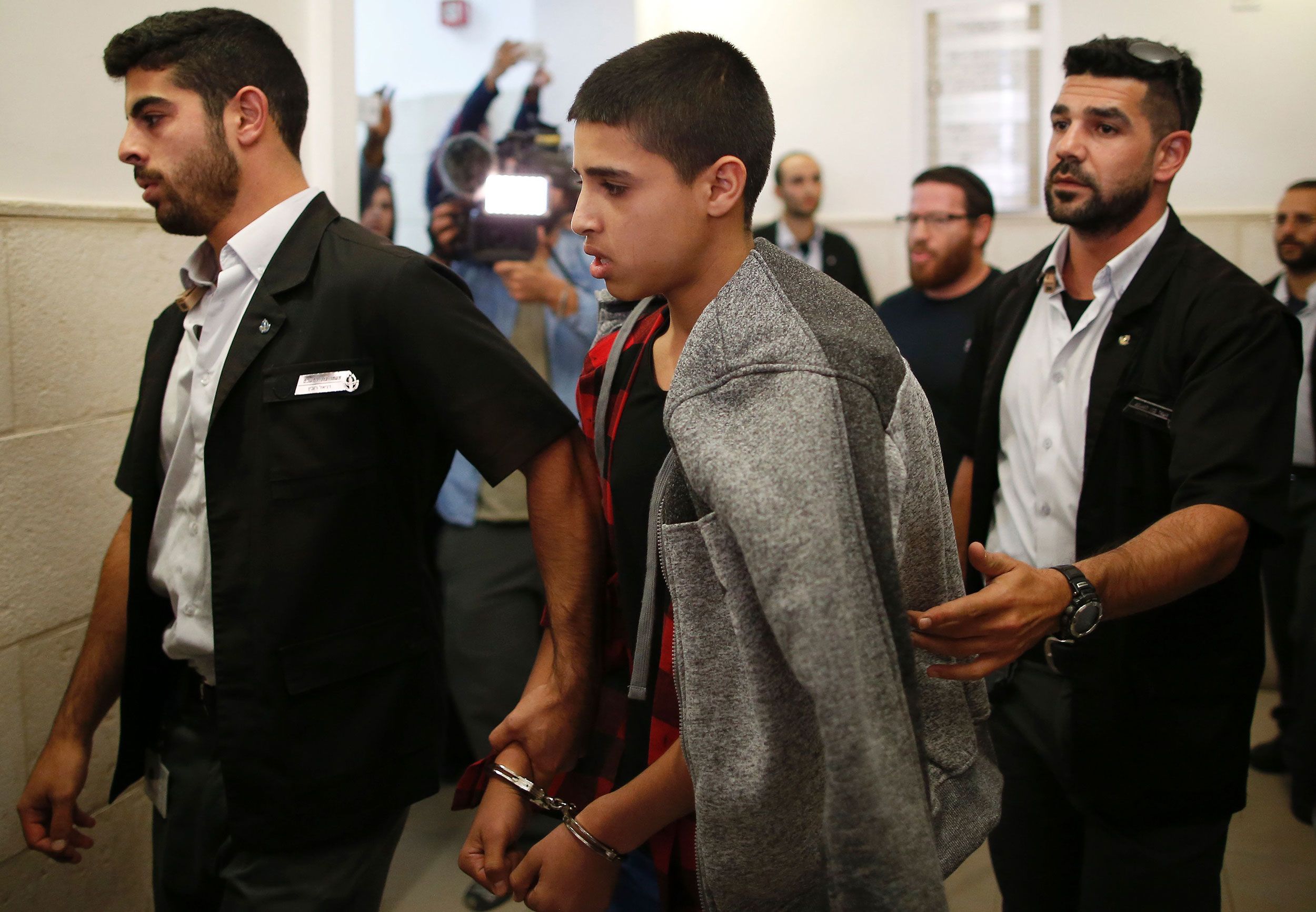 <i>Ahmad Gharabli/AFP/Getty Images via CNN Newsource</i><br/>Ahmed Manasra leaves the District Court in Jerusalem after his sentencing hearing in November 2016.