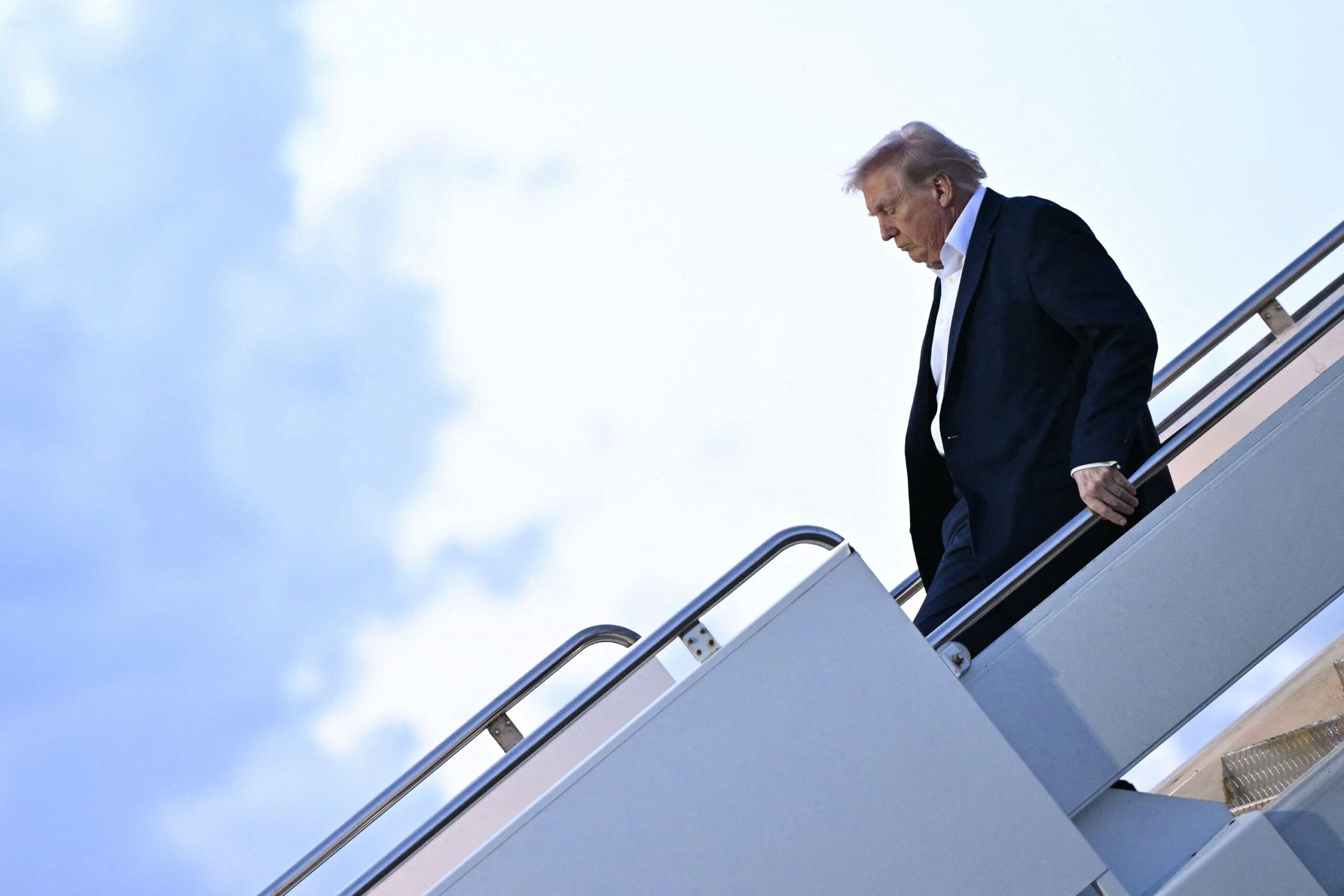<i>Mandel Ngan/AFP/Getty Images via CNN Newsource</i><br/>President Donald Trump steps off Air Force One in West Palm Beach