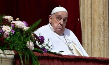 Pope Francis stands on the main balcony of St. Peter's basilica for the Urbi et Orbi message and blessing to the city and the world as part of Easter celebrations
