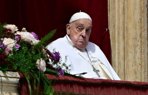 Pope Francis stands on the main balcony of St. Peter's basilica for the Urbi et Orbi message and blessing to the city and the world as part of Easter celebrations