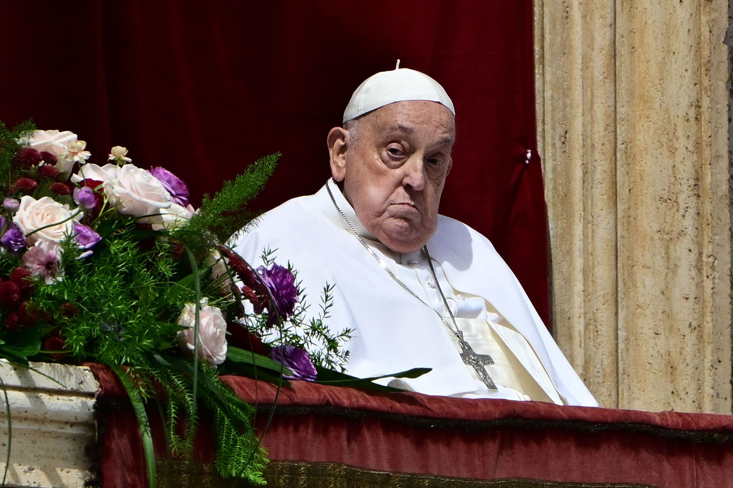 <i>Tiziana Fabi/AFP/Getty Images via CNN Newsource</i><br/>Pope Francis stands on the main balcony of St. Peter's basilica for the Urbi et Orbi message and blessing to the city and the world as part of Easter celebrations