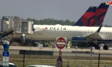 Emergency vehicles are seen on the tarmac at Orlando International Airport on April 21