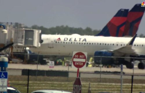 Emergency vehicles are seen on the tarmac at Orlando International Airport on April 21