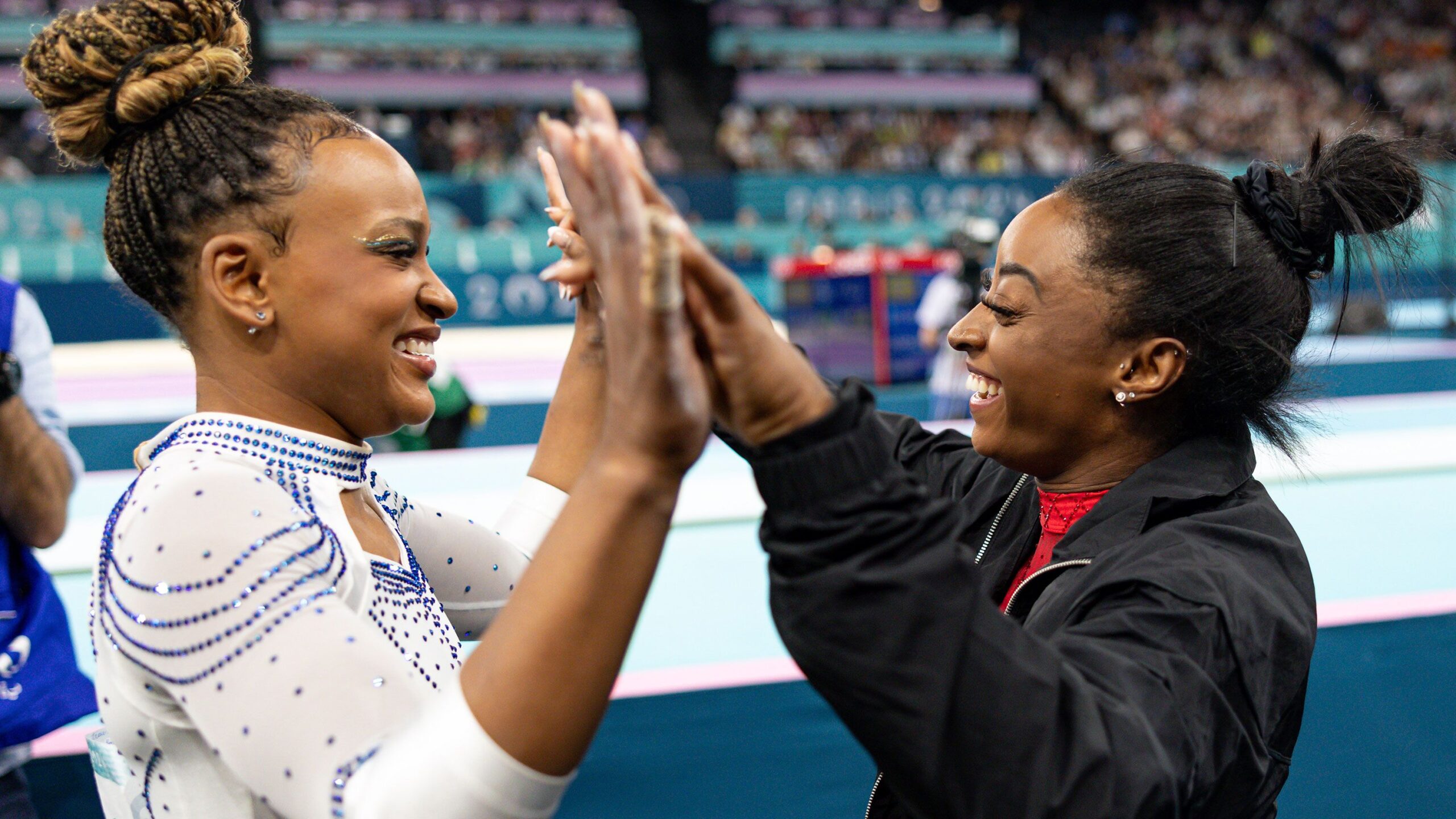 Andrade and Biles high-five after the women's artistic gymnastics vault final at the Paris 2024 Olympics in August.