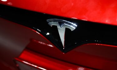 The Tesla logo is on a car at the Santa Monica