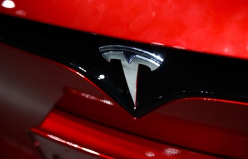 The Tesla logo is on a car at the Santa Monica