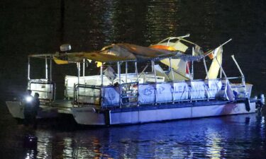 Investigators search the wreckage of a Clearwater ferry after a boat crashed into it