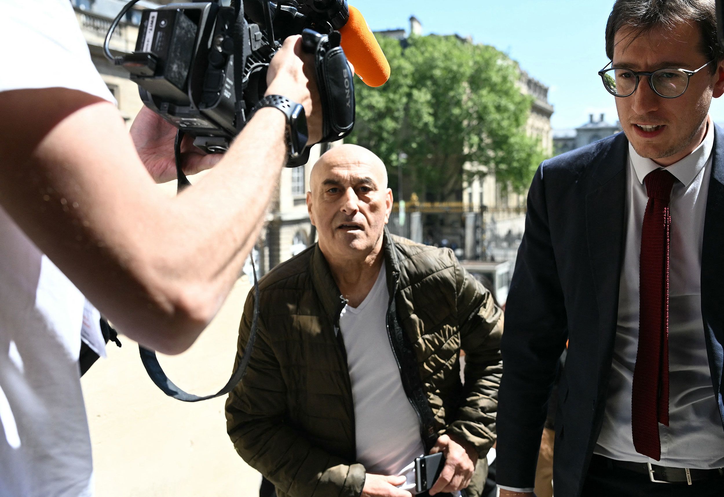 <i>Bertrand Guay/AFP/Getty Images via CNN Newsource</i><br/>Defendant Yunice Abbas and his lawyer arrive for the start of the trial in Paris on Monday