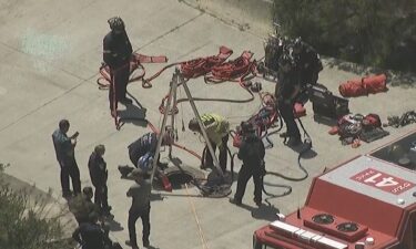 The Poway Fire Department says it is trying to rescue a person from a storm drain in the area of 14710 Beeler Canyon Road.