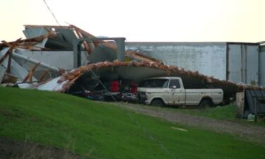The roof of a structure in Kenyon appeared to have completely collapsed on a truck.