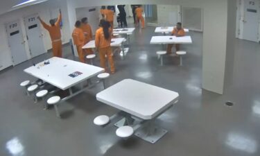 Inmates at the Cuyahoga County Jail stretching before participating in a fight club involving two female jailers.