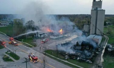 Fire crews in Pinconning are responding to a large fire at the site of a grain elevator
