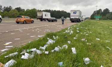 Traffic was moving smoothly again Monday on Interstate 40 at Page Road after a United States Postal Service trucks spilled mail on the side of the highway.