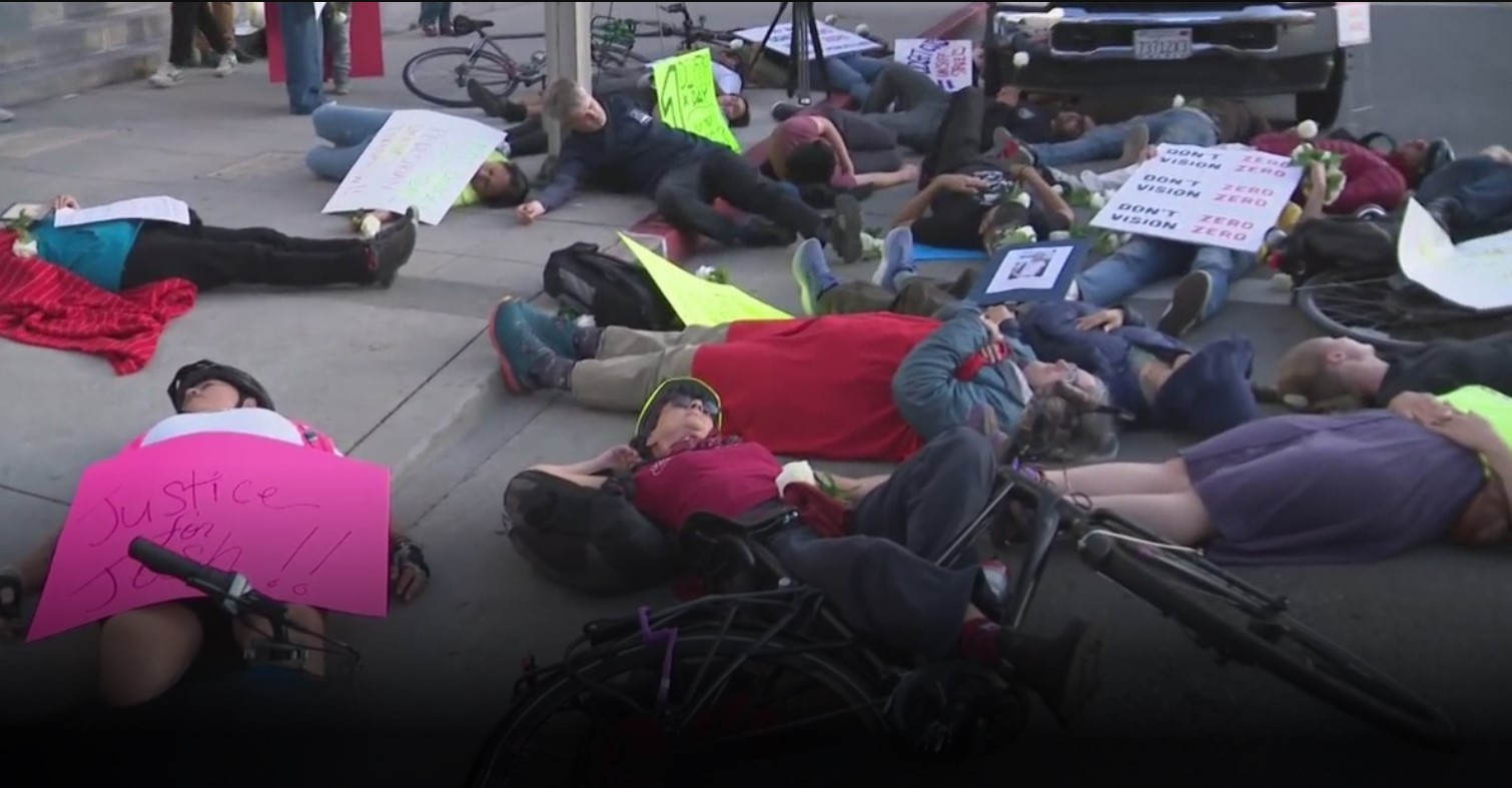 <i>KCAL/KCBS via CNN Newsource</i><br/>Nearly 100 demonstrators gathered for a "die-in" outside Los Angeles City Hall to protest the proposed budget cuts to the Department of Transportation.