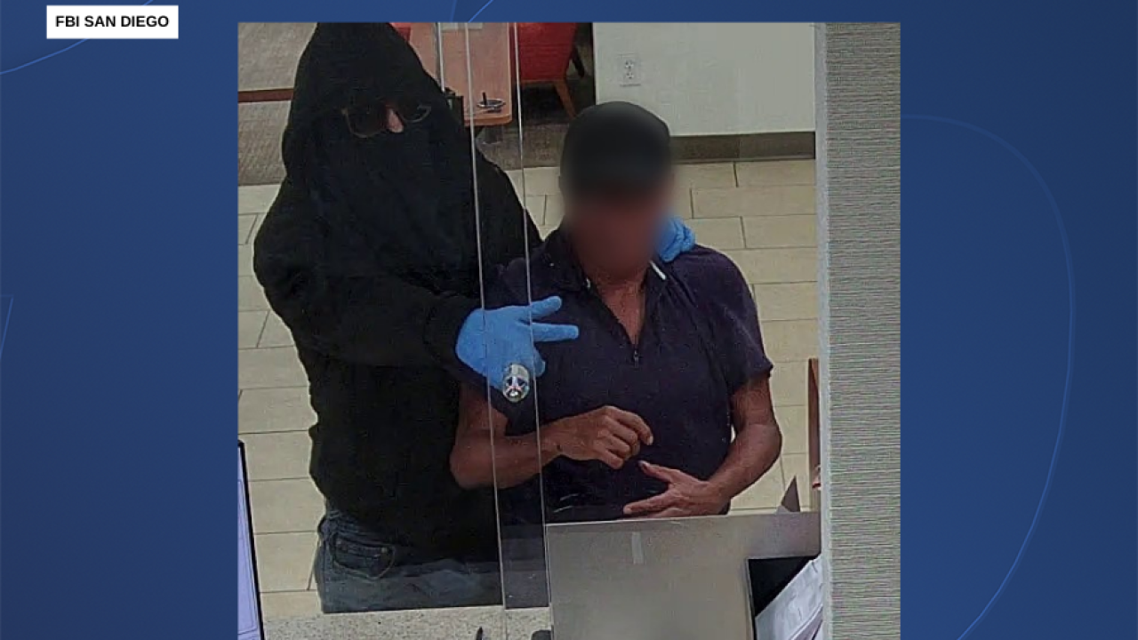 <i>KGTV via CNN Newsource</i><br/>Surveillance photos of "The Blue Glove Bandit" during a bank robbery in El Cajon on September 4